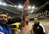 AEK Athens' Giorgos Katidis celebrates a goal during a Super League soccer match against Veria at the Olympic stadium in Athens March 16, 2013. Katidis was at the centre of a fascist row on Saturday after celebrating his winning goal in a 2-1 Super League victory over lowly Veria by appearing to give a Nazi salute to supporters. (REUTERS/Icon/Giannis Liakos)
