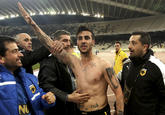 AEK Athens' Giorgos Katidis celebrates a goal during a Super League soccer match against Veria at the Olympic stadium in Athens March 16, 2013. Katidis was at the centre of a fascist row on Saturday after celebrating his winning goal in a 2-1 Super League victory over lowly Veria by appearing to give a Nazi salute to supporters. (REUTERS/Icon/Giannis Liakos)