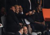 US President Barack Obama and British Prime Minister David Cameron pose for a picture with Denmark Prime Minister Helle Thorning-Schmidt next to US First Lady Michelle Obama during the memorial service of South African former president Nelson Mandela at the FNB Stadium (Soccer City) in Johannesburg on December 10, 2013. Mandela, the revered icon of the anti-apartheid struggle in South Africa and one of the towering political figures of the 20th century, died in Johannesburg on December 5 at age 95.

Roberto Schmidt / AFP Photo / Getty Images