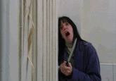 gif the shining scene of wendy hiding in the bathroom but instead of jack the girugamesh guy bursts through the door
