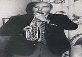 Budd Dwyer is playing the saxophone at the press conference as a state treasurer. Apologies to Bill Clinton.