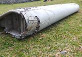 THIS IS THE PIECE OF DEBRIS SUSPECTED TO BE PART OF MISSING JET  "source":http://time.com/3986109/discovered-plane-debris-from-mh370/
Officers carrying pieces of debris from an unidentified aircraft apparently washed ashore in Saint-Andre de la Reunion, eastern La Reunion island, France, on July 29, 2015.  French police officers inspect a piece of debris from a plane in Saint-Andre, Reunion Island, on July 29, 2015.