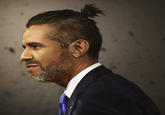 Barack Obama with man bun, beard, and earring "Source":http://www.designcrowd.com/special/politicians-with-man-buns