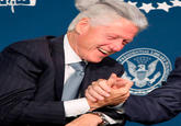 Bill Clinton with a man bun "Source":http://www.designcrowd.com/special/politicians-with-man-buns