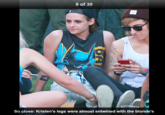 9 of 30 So close: Kristen's legs were almost entwined with the blonde's