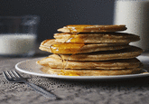 Perfectly looped cinemagraph of a stack of pancakes with syrup dripping off to the sides