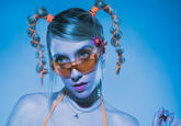 LIZ Aw shucks I can't find the photographer for this. This isn't a contemporary pic though, LIZ is a rather new artist whose gimmick is to give off Y2K vibes.