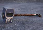 By The Hammer Of Thor hammer of thor made out of Nokia 3310 phones bricked together into a hammer head