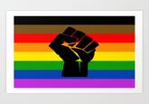 black raised fist over a rainbow background black and brown inclusive pride flag