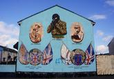 The Shankill Mona Lisa is one of the famous <a href="https://en.wikipedia.org/wiki/Murals_in_Northern_Ireland">Northern Ireland Wall Murals</a> that rose as a way of marking territory during The Troubles to make it clear which side controlled the area.

The Shankill Mona Lisa got it's name due to fact that the UFF (Ulster Freedom Fighters) soldier was painted in such a way, that no matter which angle you viewed it from, he would always be pointing the gun at the viewer.

It was removed in 2015 as part of the national effort to try and ease ethnic and political tensions in Northern Ireland. 