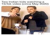Two Indian kids watching TikTok video (circa May 2020)