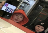 Two Kids In a Vape Shop Showing Vapes On Their Phone and One's Wearing a TikTok Beanie -130 18 CA τίπο