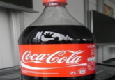 Coca-Cola DE NOW M OSSTOFFE Schutzmarke 2L e2,0 200