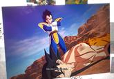 Goku falls to Vegeta's attack.