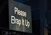 A photoshop of the "please wrap it up" teleprompter from the game awards 2023. The teleprompter now reads "please brap it up."