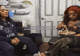A GIF of Natalie and Stunna Girl from "Baddies West." In the GIF, Natalie is looking at Stunna GIrl's nachos. The GIF caption reads, "you can tell natalie lowkey wanted stunna girls nachos."