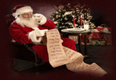 A GIF of Santa Claus reading the naughty and nice list. A tree twinkles in the background.