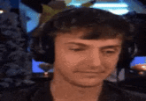 A GIF of streamer Ninja biting his lip and smiling slyly when asked for a haircut recommendation. The GIF is referencing the Low Taper Fade meme.