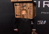 Photoshop of Jaden Smith wearing Shrek's outhouse on his head.