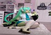 A green alien-inspired "Glorpi" Miku cosplayed by X user @purplesakura__, inspired by a reference sheet posted by @dyarikku. The cosplay reimagines the vocaloid Hatsune Miku as a green alien.