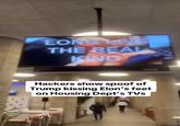 LONGYNE THE REAL KING Hackers show spoof of Trump kissing Elon's feet on Housing Dept's TVs