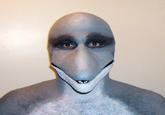 One of the original "Dolphin Man" photos of a man wearing a realistic dolphin mask, sourced from the website of the latex prosthetic manufacturer NorthFur FX. The image inspired the Dolphin Man "creepypasta":https://knowyourmeme.com/memes/creepypasta.