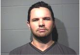 Patrick's mugshot from his 2011 arrest for threatening to murder his own wife and newborn daughter.