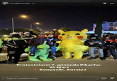 Photo of a group of costumed protestors posing with the police in Antalya.