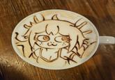 A latte with VitzyPie's face in it. The image was posted by X user george_10g.