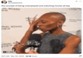 A meme that features a GIF of Cynthia Erivo tapping her bald head alongside the phrase "the concept of." This tweet reads, "the concept of being unemployed and watching movies all day."