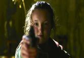 A still from "_The Last of Us_":https://knowyourmeme.com/memes/subcultures/the-last-of-us-hbo-series TV series showing actor "Bella Ramsey":https://knowyourmeme.com/memes/bella-ramseys-face as Ellie Williams pointing a gun.