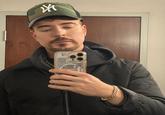A photo taken by "MrBeast":https://knowyourmeme.com/memes/people/mrbeast of him recreating the viral MrLean / Hood MrBeast "AI":https://knowyourmeme.com/memes/cultures/ai-artificial-intelligence and "photoshop":https://knowyourmeme.com/memes/sites/photoshop edit trend.