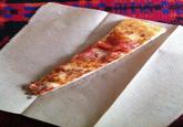A thin slice of pizza. The image is often used to represent the pizza slices given out at school pizza parties.