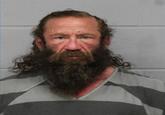 Liver King's mugshot. He was arrested in June 2025 on a charge of terroristic threat towards Joe Rogan.