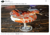 A photo of a cocktail with a hot chicken as a garnish, captioned, "Just a lil something to take the edge off."