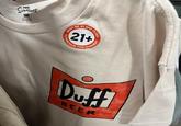 тне SIMPSONS 10 T4020hion NAT GROEING 29 MUST BE 21 AND OLDER 21+ TO PURCHASE TH GARMENT Duff BEER