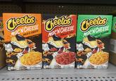 Cheetos Mac'N CHEESE BOLD & CHEESY FLAVOR Cheetos Mac'N CHEESE Flamin Hot RAND Cheetos Mac'N CHEESE CHEESY JALAPEÑO FLAVOR RAND Per Serving WITH Per Serving PASTA WITH Per Serving 20 PAVAROSAGE MET WIT 5.9 0Z (170 ₫) 4223 PAVORED SAUCE LIVET WIT 5.6802 (160) ARNAV FLAVORED SAUCE NET WT 5.7 OZ (164 g) 499/000 03 21