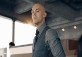 A "GIF":https://knowyourmeme.com/memes/cultures/gif of Lex Luther, played by Nicholas Hoult in the 2025 "_Superman_":https://knowyourmeme.com/memes/subcultures/superman-2025-film film, seen standing in an office in a grey suit, scowling as the camera pans.