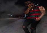 A photo of streamer "Low Tier God":https://knowyourmeme.com/memes/people/low-tier-god, also known as LTG or Dale Wilson, wearing an outfit inspired by the character "Freddy Krueger":https://knowyourmeme.com/memes/smoking-freddy-krueger from the _A Nightmare on Elm Street_ horror film franchise.