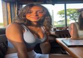 A popular Evelyn Smith meme. The image shows evelynsmithhhhh sitting in a restaurant staring.