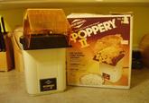 WEST BEND POPPERY UEST BEND. Qt. Automatic Hot Air Com Popper POPPERY ㅍ THE FASTEST CORN POPPER AROUND- sp to quarts in about 3 minutes COMPACT-ty a foot high HOT AIR-popcone's more tritious scithout oil UL No. 82