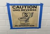 CAUTION UNO REVERSE S TOILET IN OPERATION