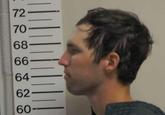 A side profile mugshot of Tyler Robinson, the suspected shooter who "assassinated Charlie Kirk":https://knowyourmeme.com/memes/events/charlie-kirk-shooting-at-utah-valley-university at Utah Valley University in September 2025.