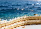 An AI image of a cake. The cake also resembles the ocean.