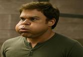 An "AI image":https://knowyourmeme.com/memes/cultures/ai-art of Dexter Morgan with massive, puffed-out cheeks.
