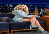 A photograph of singer "Sabrina Carpenter":https://knowyourmeme.com/memes/people/sabrina-carpenter on "_The Tonight Show Starring Jimmy Fallon_":https://knowyourmeme.com/memes/people/jimmy-fallon, which was lated edited using "AI":https://knowyourmeme.com/memes/cultures/ai-artificial-intelligence to make Carpenter fat.