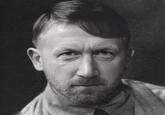 A "Face Swap":https://knowyourmeme.com/memes/face-swap of "English":https://knowyourmeme.com/memes/british-people-briish "football":https://knowyourmeme.com/memes/cultures/association-football manager Graham Potter on the body of "Adolf Hitler":https://knowyourmeme.com/memes/people/adolf-hitler.