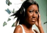 An edited version of the Girl With Headphones meme, in which she looks unhappy with a frown on her face, looking at the viewer.