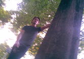 A photo of Tom Cruise leaning on a tree in Munich. The photo is from a 2010 blog post 