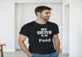 A T-shirt reading, "My sister is an foid," which started the "ironic":https://knowyourmeme.com/memes/ironic-memes "foid":https://knowyourmeme.com/memes/foid-slang memes in 2025.